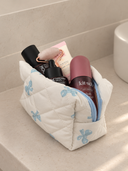 Trousse matelassée nœud bleu